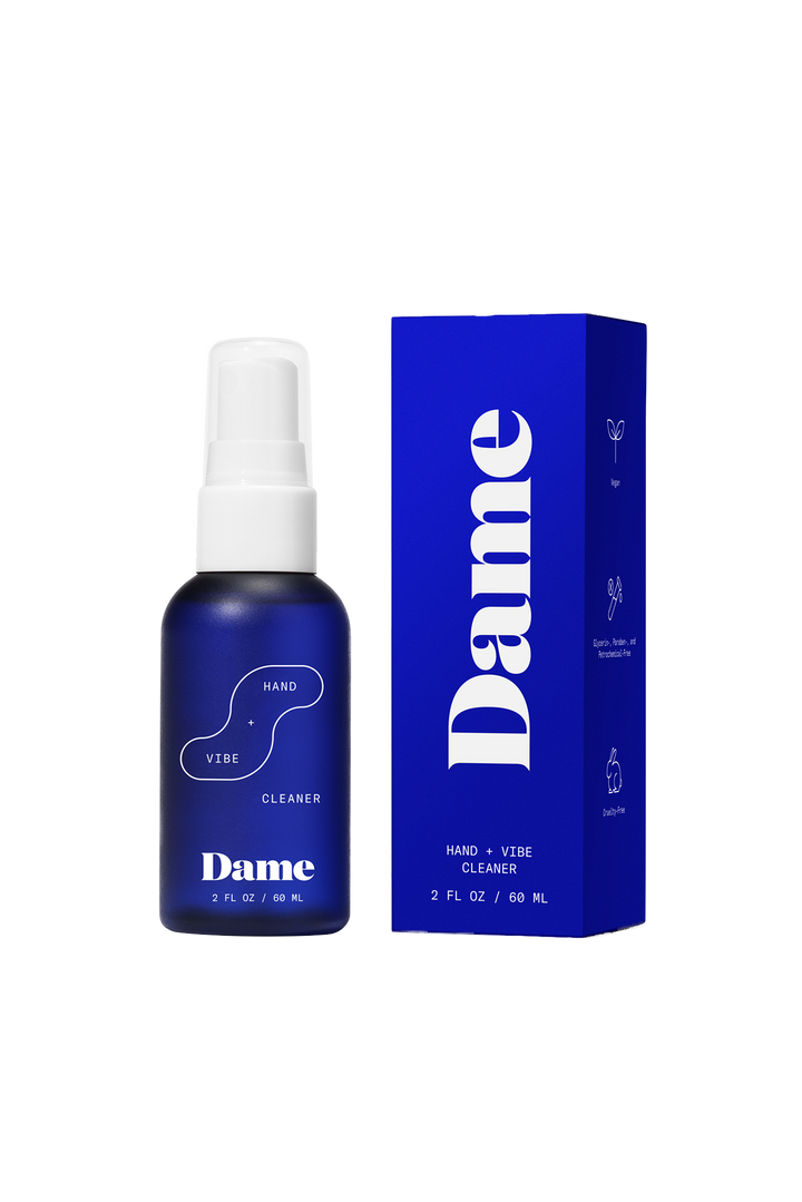 Hand + Vibe Cleaner | Seamless | A white 2floz bottle with Dame's bright blue logo on beige background.