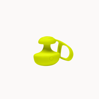 Dame Fin finger vibrator in Citrus worn between two fingers