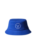 | A royal blue bucket hat with Dame's O-face embroidered onto it in white. Beige background.