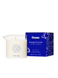 Melt Together | Dame Massage Oil Candle out of the box next to its blue packaging box