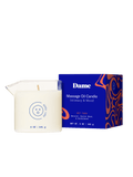 Soft Touch | Dame Massage Oil Candle out of the box next to its blue packaging box