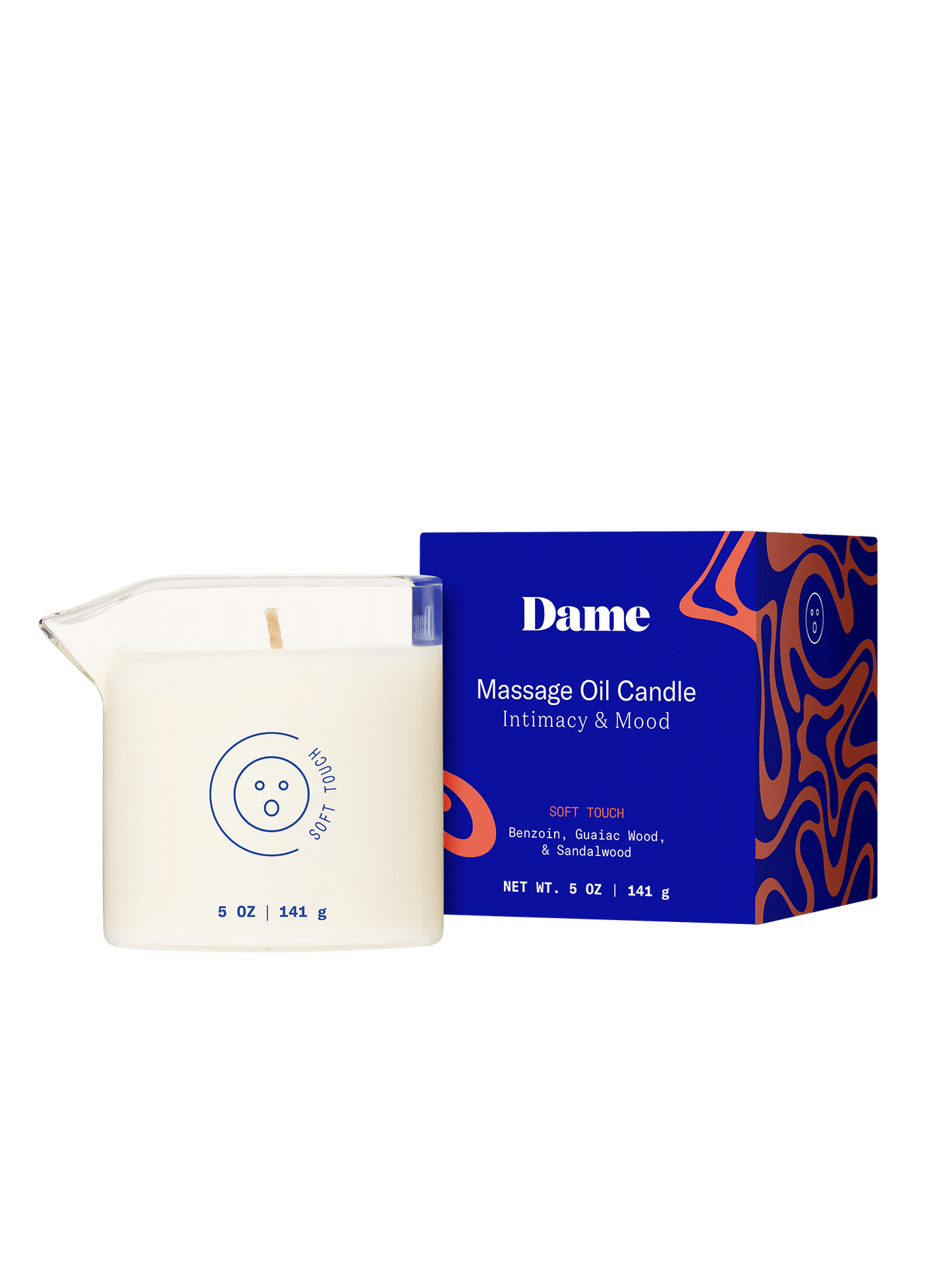 Soft Touch | Dame Massage Oil Candle out of the box next to its blue packaging box