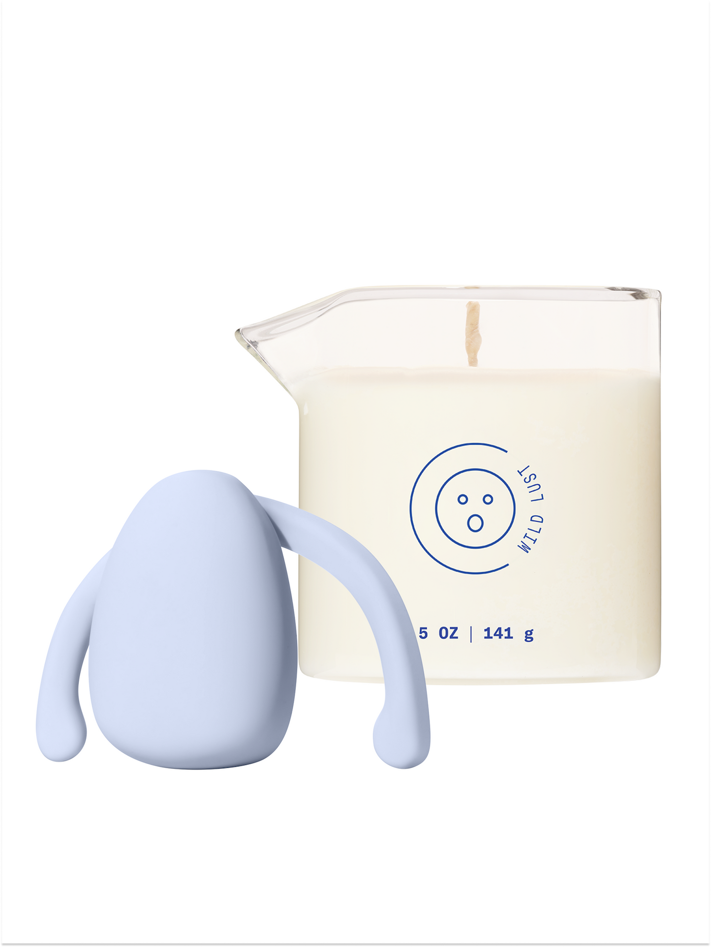 Eva hands-free vibrator in light blue/periwinkle next to massage oil candle in scent Wild Lust.
